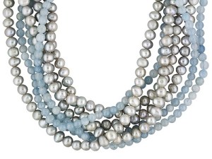 This necklace has 5 strands of silver pearls and 3 strands of aquamarine beads.