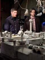 Dean and Sam check out a model of the town.