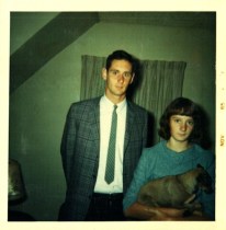My brother, home from college, poses for a picture with me and the family dog.