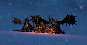 The dragons protect the humans and animals in a snowstorm.