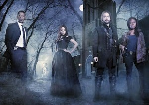 The cast of Sleepy Hollow poses in the forest.