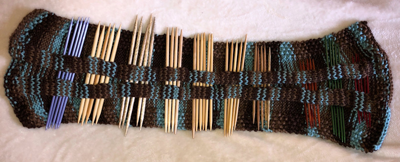 My double pointed needles are all organized in a knitting needle cozy.